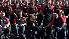 FILE - Britain's Prince Harry poses with the team during the announcement of the British Armed Forces team for the Invictus Games in London, Wednesday, Aug. 13, 2014