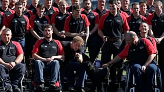 FILE - Britain's Prince Harry poses with the team during the announcement of the British Armed Forces team for the Invictus Games in London, Wednesday, Aug. 13, 2014