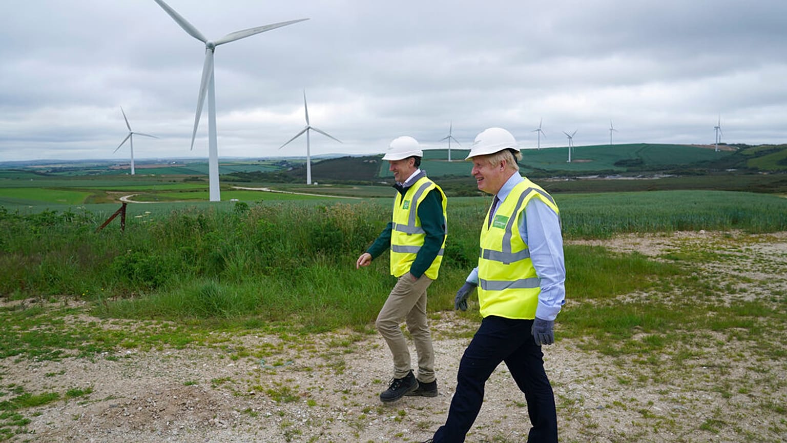 Boris Johnson visits Scottish Power Carland Cross Windfarm to view new construction on a solar farm in Newquay, Cornwall, England