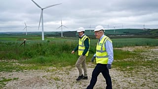Boris Johnson visits Scottish Power Carland Cross Windfarm to view new construction on a solar farm in Newquay, Cornwall, England