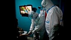 Ambulance workers attend a COVID-19 patient suffering oxygen problems in Lomas de Zamora, Argentina, June 10, 2021.