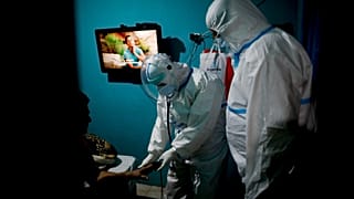 Ambulance workers attend a COVID-19 patient suffering oxygen problems in Lomas de Zamora, Argentina, June 10, 2021.