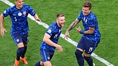 Slovakia's Milan Skriniar, centre, celebrates after scoring his side's second goal during the Euro 2020 soccer championship group E match between Poland and Slovakia