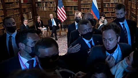 Security members push the press out at Villa La Grange in Geneva on June 16, 2021. 