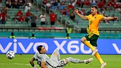 Wales' Aaron Ramsey, right, scores his sides first goal past Turkey's goalkeeper Ugurcan Cakir