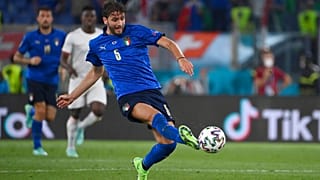 Italy's Manuel Locatelli, left, scores his side's first goal during the Euro 2020 soccer championship group A match between Italy and Switzerland at the Rome Olympic stadium, 