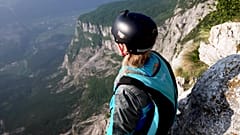 Evelina Overling prepares to base jump at Mount Brento