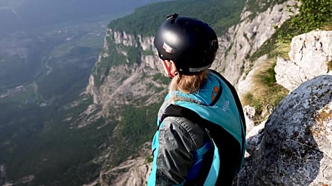Evelina Overling prepares to base jump at Mount Brento