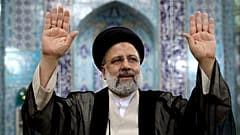 Ebrahim Raisi, a candidate in Iran's presidential elections waves to the media after casting his vote at a polling station in Tehran, Iran Friday, June 18, 2021