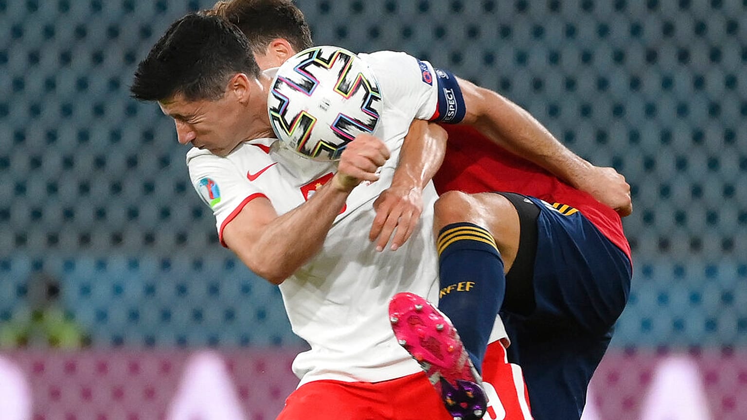 Poland's Robert Lewandowski and Spain's Pau Torres, behind, challenge for the ball during the Euro 2020 match on Saturday