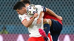 Poland's Robert Lewandowski and Spain's Pau Torres, behind, challenge for the ball during the Euro 2020 match on Saturday