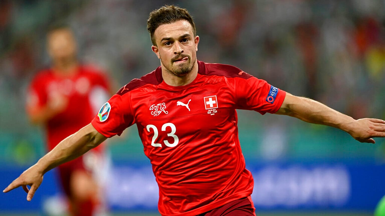 Switzerland's Xherdan Shaqiri celebrates scoring his side's third goal against Turkey on Sunday