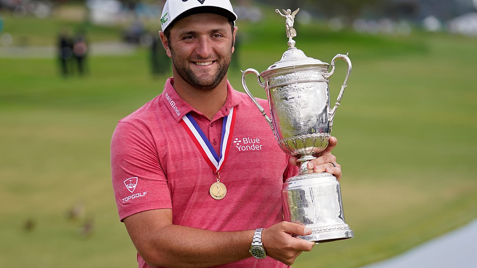 Jon Rahm holds aloft the US Open trophy for photographers after the final round at Torrey Pines Golf Course in San Diego.