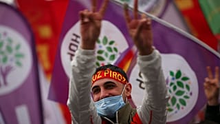 A member of the People's Democratic Party, or HDP, attends the start of Nowruz - or New Year - celebrations in Istanbul, Turkey in March
