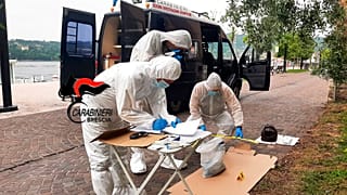 Italian forensic police on the scene at Lake Garda after the bodies of an Italian man and woman were found on Sunday