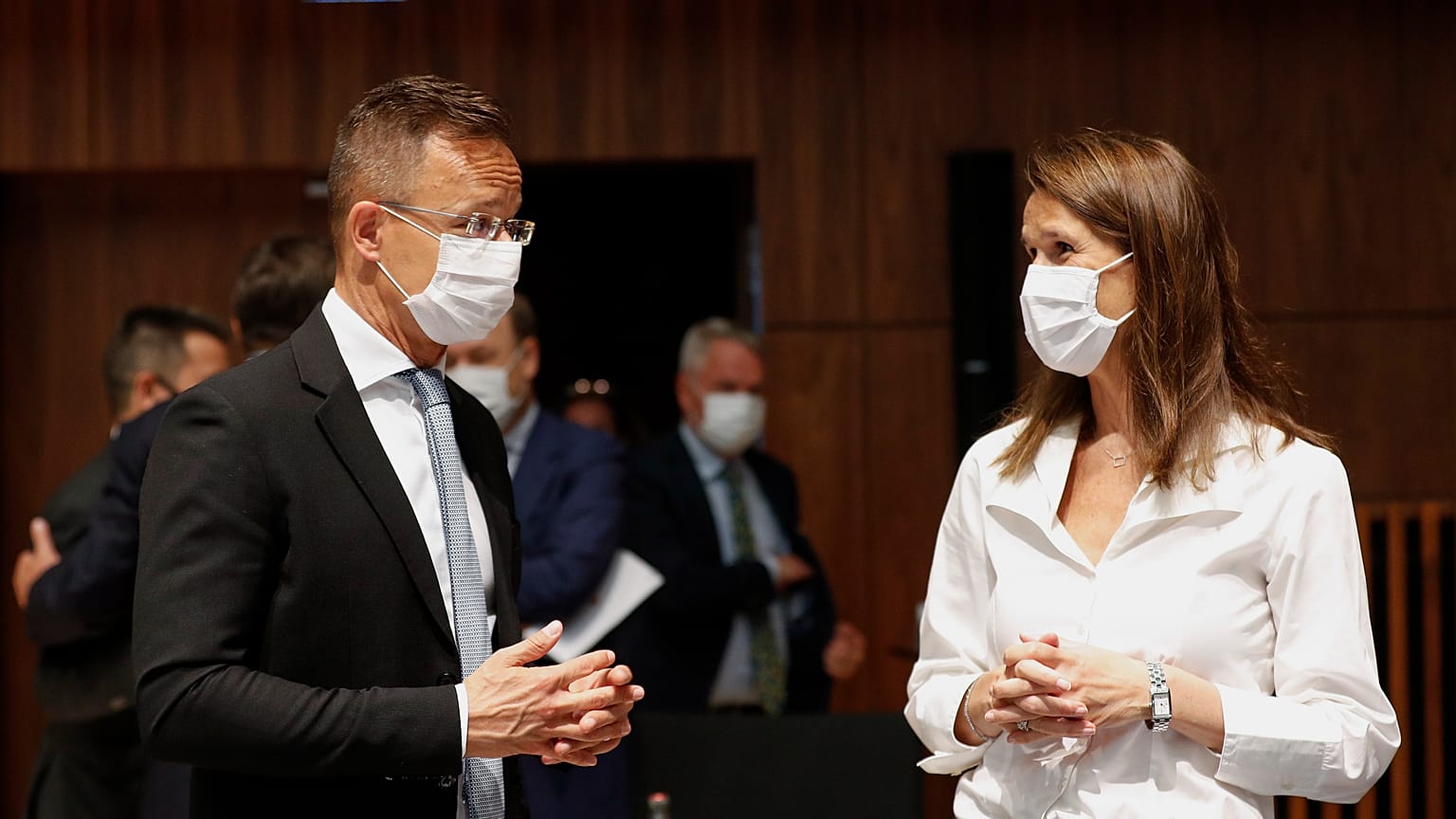 Belgium's Foreign Minister Sophie Wilmes talks to her Hungarian counterpart Peter Szijjarto.