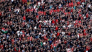 n this June 15, 2021 file photo, Hungarian fans wait for the start of the Euro 2020 championship group F match between Hungary and Portugal at the Ferenc Puskas stadium.