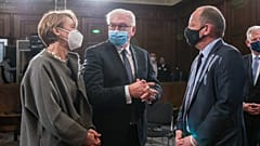 German President Frank-Walter Steinmeier (C) and his wife Elke Buedenbender talk with Philippe Sands, author, lawyer and international law expert