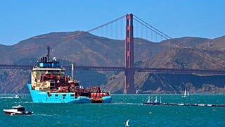 FILE: A ship tows The Ocean Cleanup's first buoyant trash-collecting device toward the Golden Gate Bridge en route to the Pacific Ocean (2018)