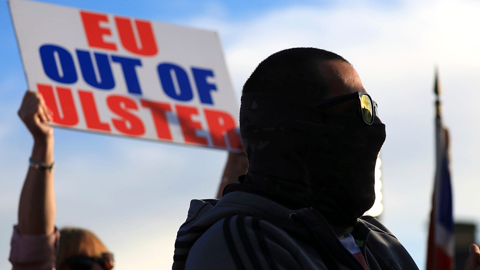 A Loyalist opposed to the Northern Ireland Protocol attends a rally in Newtownards town centre, Northern Ireland, Friday, June 18, 2021.