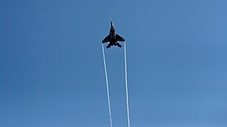 A Serbian Army MiG-29 jet fighter performs over Batajnica during military exercises.