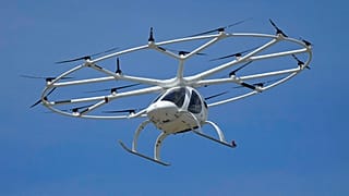 Urban air taxi 'Velocity' produced by company Volocopter makes a test flight during an event at the Air and Space Museum in Le Bourget, east of Paris, Monday, June 21, 2020.