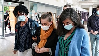 Valerie Bacot, centre, arrives with relatives at the Chalon-sur-Saone courthouse, central France, Thursday, June 24, 2021. 