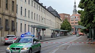 Police cars attend the scene of knife attack in Wuerzburg, Germany, Friday June 25, 2021