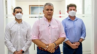 President Ivan Duque speaks, flanked by Interior Minster Daniel Palacios, left, and Defence Minister Diego Molano, in Cucuta, Colombia, Friday, June 25, 2021.