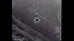 An unexplained object is seen at centre as it is tracked as it soars high along the clouds in footage provided by the US Department of Defence.
