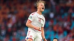 Denmark's Kasper Dolberg celebrates after scoring his side's second goal during the Euro 2020 soccer championship round of 16 match between Wales and Denmark.