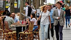 FILE: People walk at the Champs Elysees avenue in Paris, Thursday, June 17, 2021. 