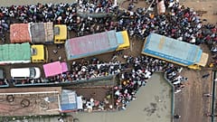 June 27, 2021, people board a ferry as authorities ordered a new lockdown to contain the spread of the Covid-19 coronavirus, in Munshiganj.
