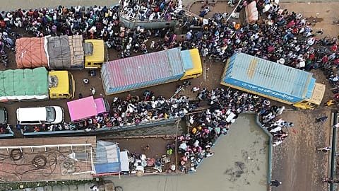 Migrant workers flee capital as Bangladesh tightens Covid lockdown