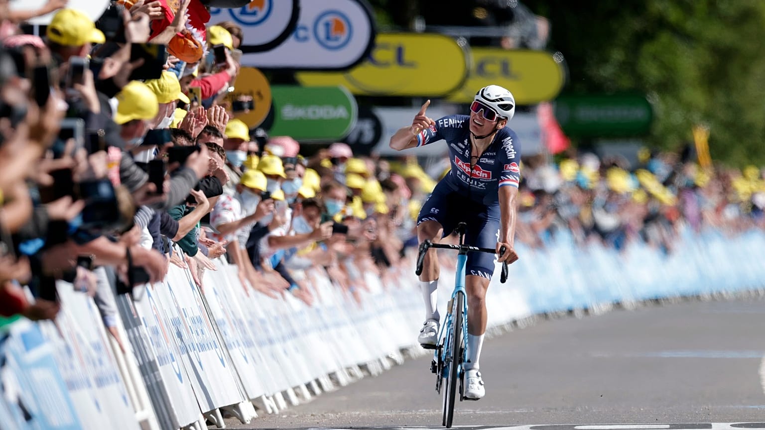 Mathieu Van Der Poel celebrates as he crosses the finish line to win the second stage of the Tour de France cycling race.