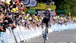 Mathieu Van Der Poel celebrates as he crosses the finish line to win the second stage of the Tour de France cycling race.