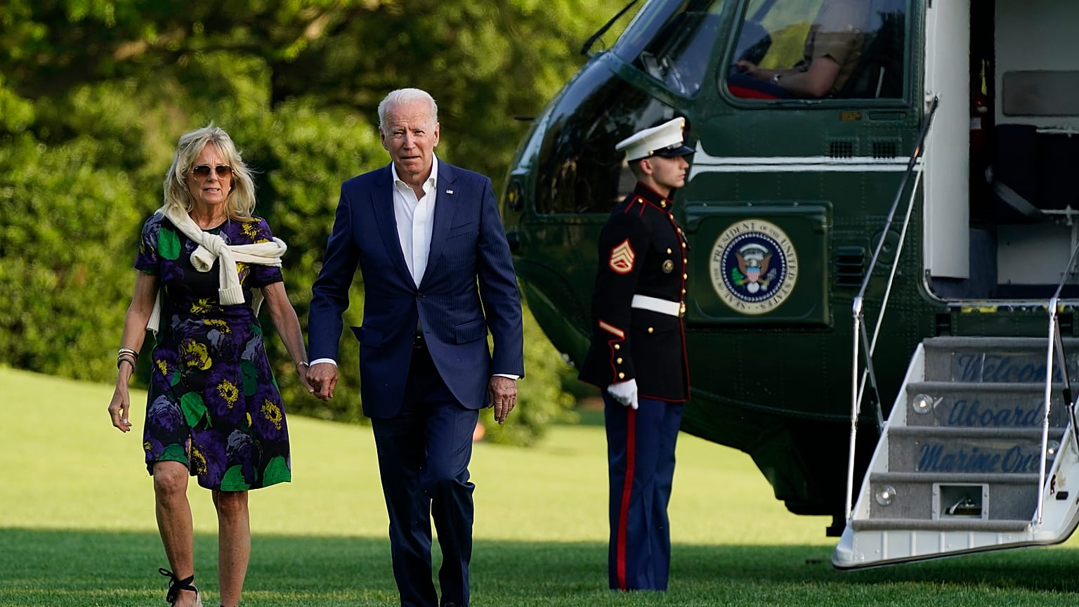 President Joe Biden and first lady Jill Biden walk on the South Lawn of the White House after stepping off Marine One, Sunday, June 27, 2021, in Washington. 