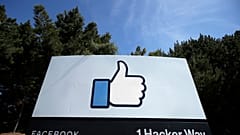In this April 14, 2020 file photo, the thumbs up Like logo is shown on a sign at Facebook headquarters in Menlo Park, California.