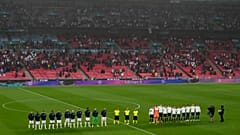 Players stand for national anthems during the Euro 2020 match between England and Scotland, at Wembley Stadium, in London, Friday, June 18, 2021.