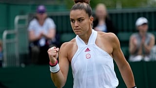 Maria Sakkari of Greece celebrates winning a point against Netherland's Arantxa Rus 