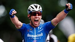 Britain's Mark Cavendish celebrates as he crosses the finish line to win the fourth stage of the Tour de France on June 29, 2021.