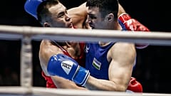 Kazakhstan's Kamshybek Kunkabayev (R) fights with Uzbekistan's Bakhodir Jalolov during the AIBA men's super heavy weight final in Yekaterinburg, Russia, Sept. 21, 2019.