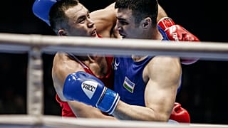 Kazakhstan's Kamshybek Kunkabayev (R) fights with Uzbekistan's Bakhodir Jalolov during the AIBA men's super heavy weight final in Yekaterinburg, Russia, Sept. 21, 2019.