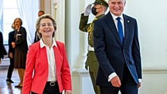 Lithuania's President Gitanas Nauseda and European Commission President Ursula von der Leyen, left, arrive for their meeting at the Presidential palace in Vilnius, Lithuania, 