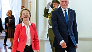 Lithuania's President Gitanas Nauseda and European Commission President Ursula von der Leyen, left, arrive for their meeting at the Presidential palace in Vilnius, Lithuania, 