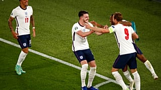 England's Harry Kane, right, celebrates after scoring his side's third goal during the Euro 2020 soccer championship quarterfinal match between Ukraine and England.