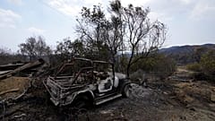 A burned car is seen on Troodos mountain