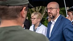 European Council President Charles Michel and Lithuania's Prime Minister Ingrida Simonyte speak with members of the Lithuania State Border Guard on Tuesday.
