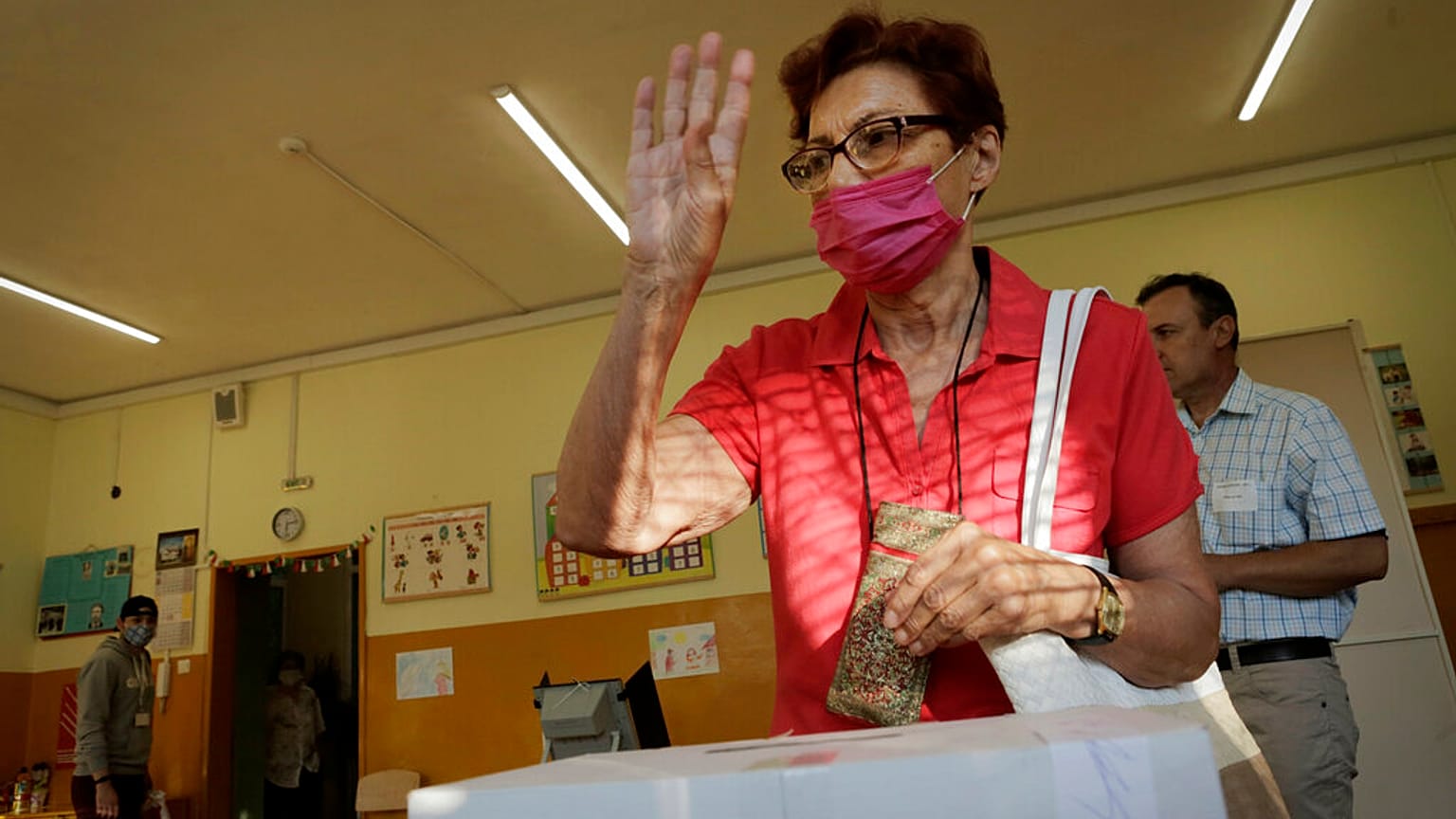 A woman reacts after casting her vote in Sofia on Sunday