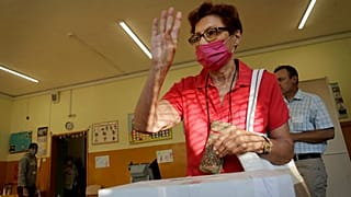 A woman reacts after casting her vote in Sofia on Sunday